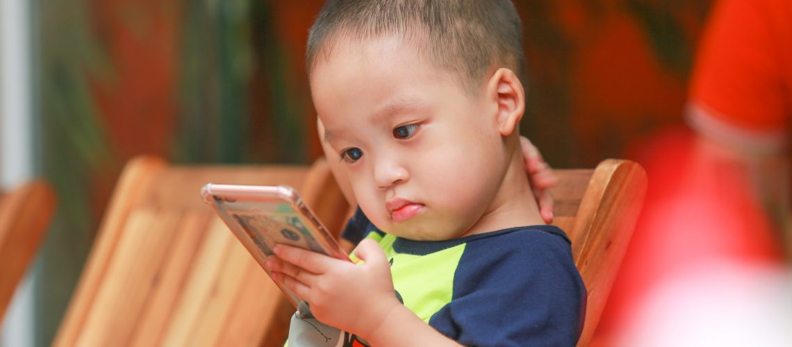 blurred-background-boy-cellphone-2181423